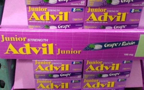A stack of boxes filled with advil.
