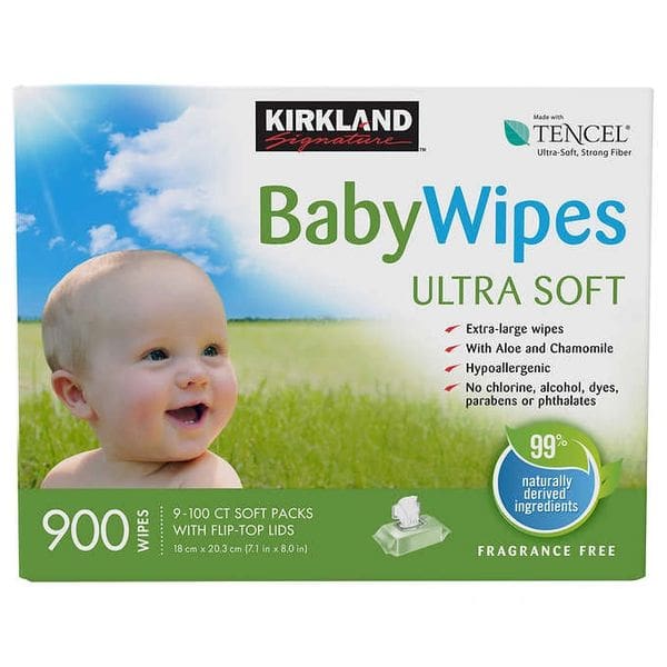 A box of baby wipes that are in the grass.