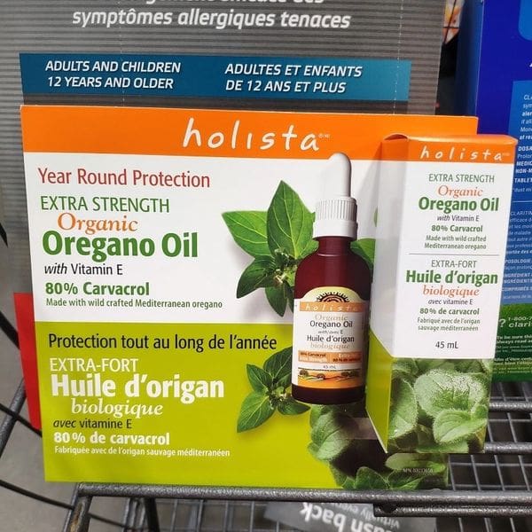 A box of oregano oil sitting on top of a store shelf.