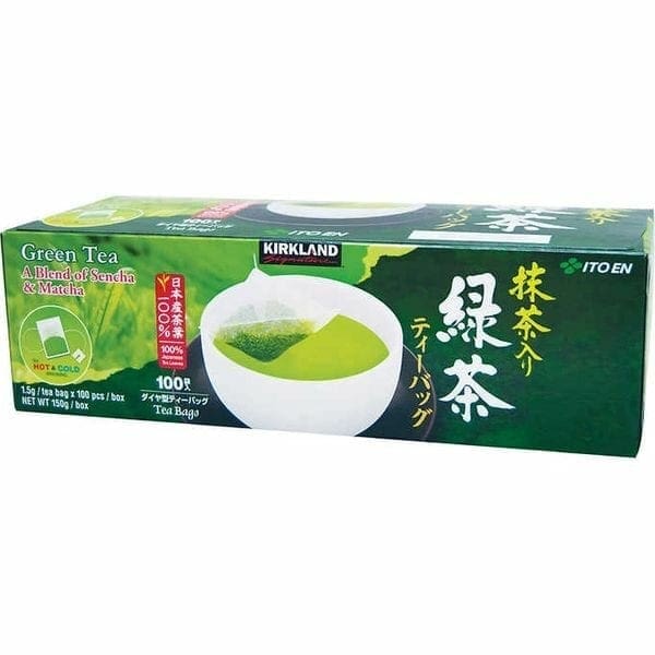 A box of green tea with a cup in front.