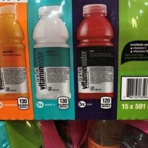 A close up of four different drinks in plastic wrappers