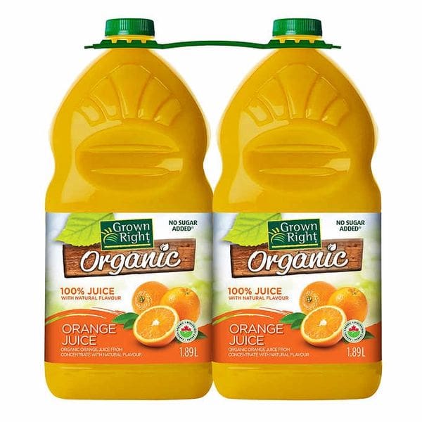 Two bottles of orange juice with a green straw.
