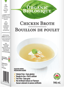 A box of chicken broth with a white bowl.