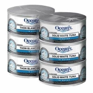 A group of six cans of ocean 's tuna.