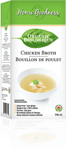 A box of chicken broth with a white bowl.