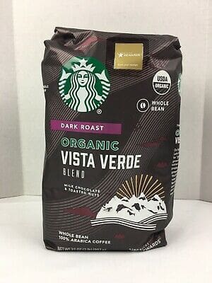A bag of starbucks coffee on top of a table.