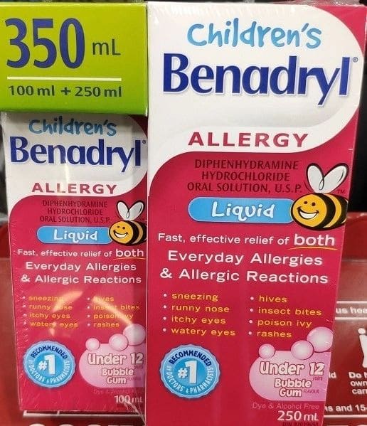 A bottle of children 's benadryl is shown next to another.