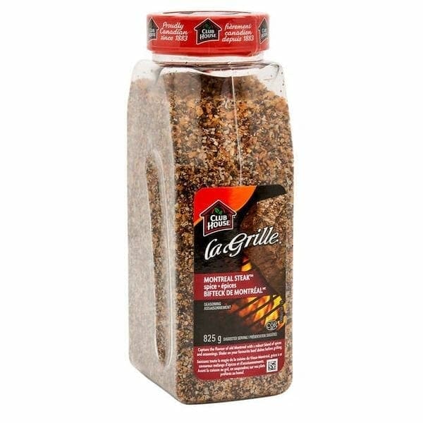 A large jar of food with brown rice and nuts.