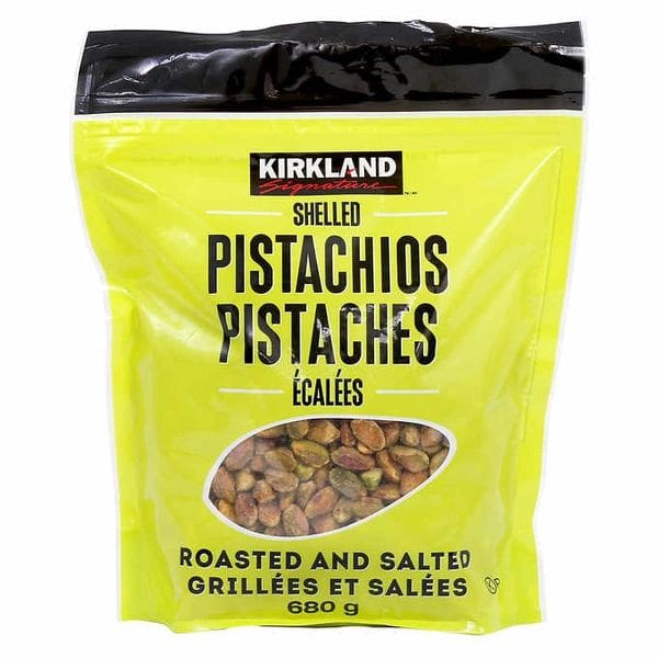A bag of pistachios is shown on a white background.