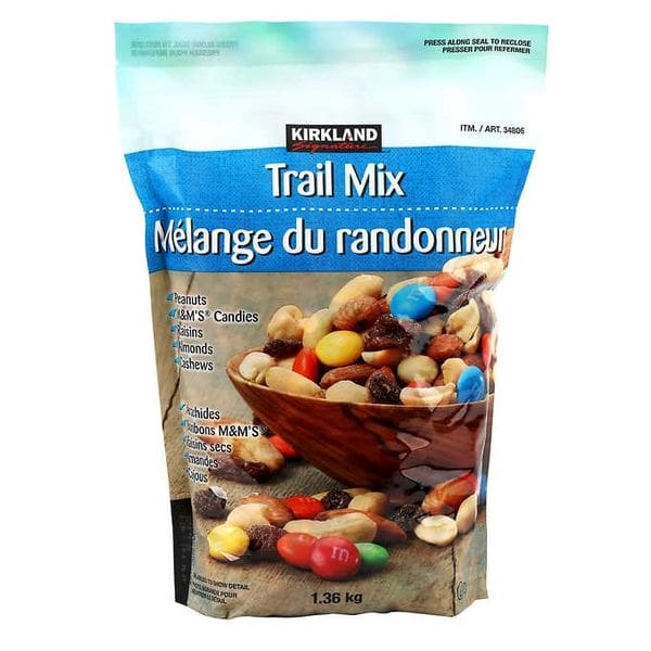 A bag of trail mix with different types of candy.