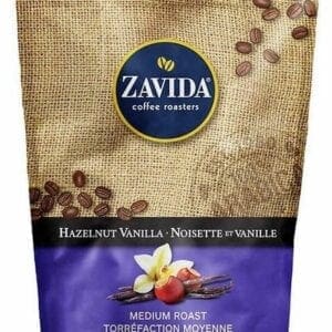 A bag of coffee beans with vanilla pods on it.