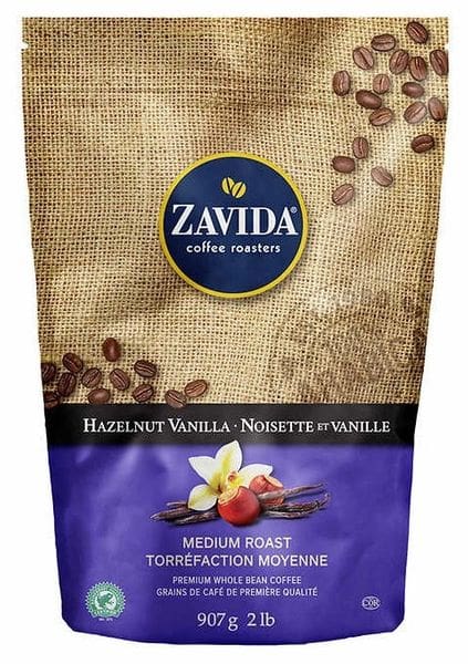A bag of coffee beans with vanilla pods on it.