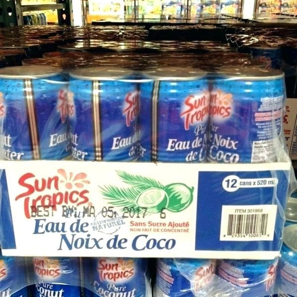 A display case of coconut water in a store.