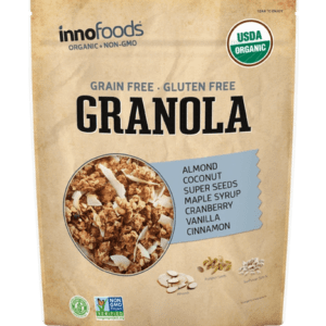 A bag of granola is shown on top of a green paper.