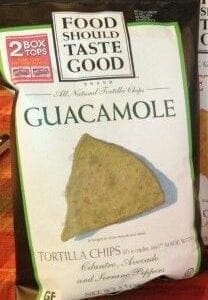 A package of tortilla chips that are labeled " taste good guacamole ".