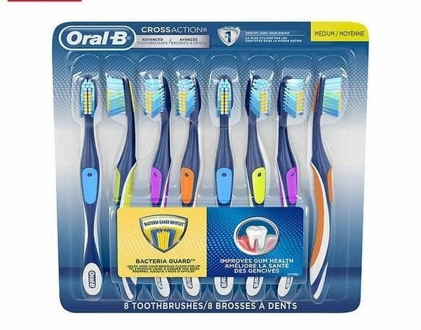 A package of tooth brushes with different colors.