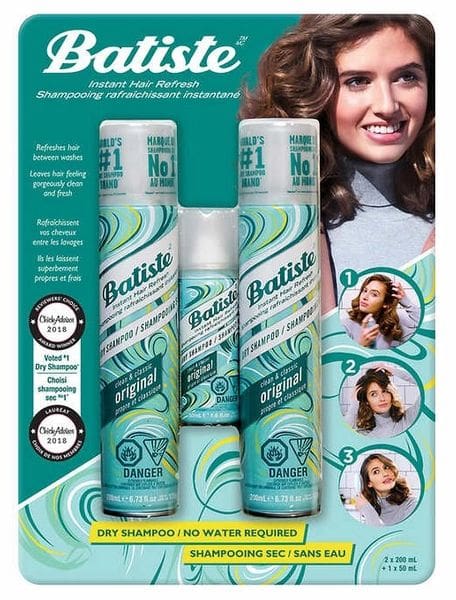 A package of hair products with a woman in the background.