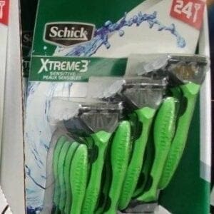 A package of green scissors in the store.