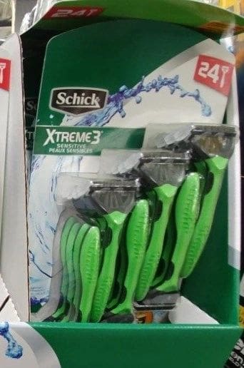 A package of green scissors in the store.