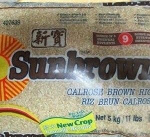 A bag of brown rice sitting on top of a table.