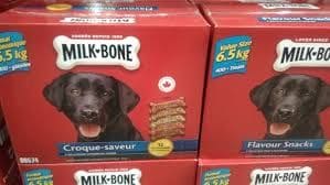 A stack of milk bone dog treats in boxes.