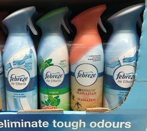 A display case with four different bottles of febreze.