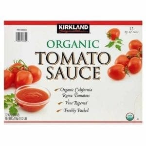 A box of organic tomato sauce with tomatoes.
