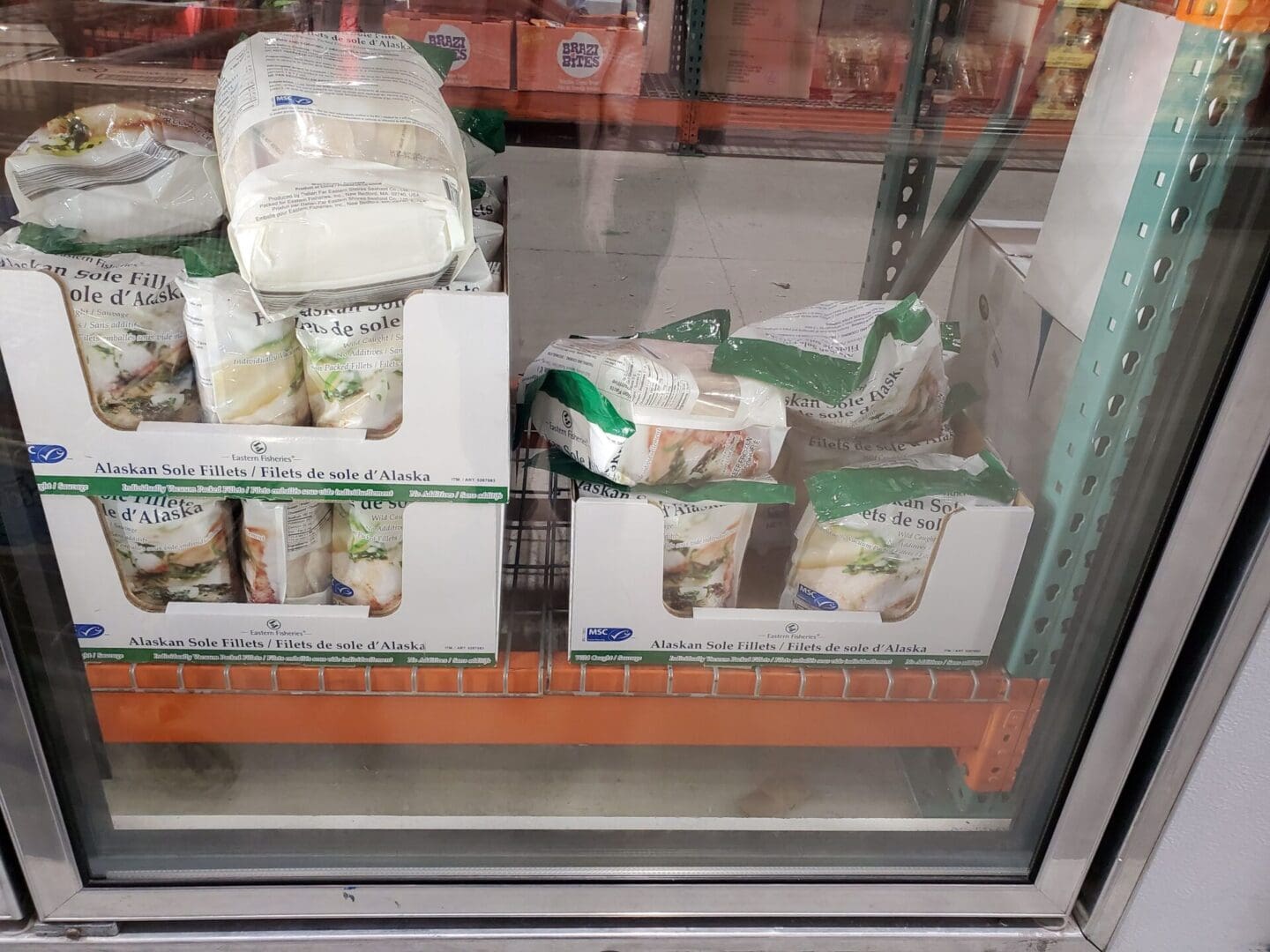 A window with boxes of food in it