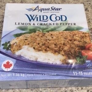 A box of frozen fish with a package on the side.