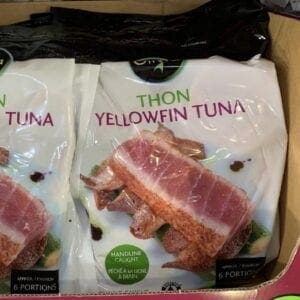 A box of tuna with bacon on it