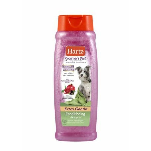 A Hartz Living Groomer's Best 3 in 1 Conditioning Dog Shampoo with a dog on it.