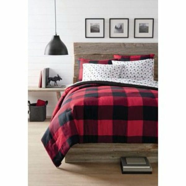 A Canadiana 3 Piece Reversible Comforter Set in a bedroom.