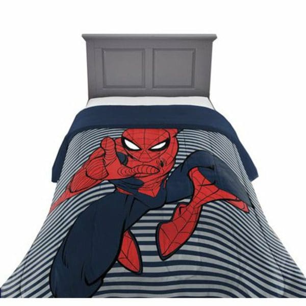 A bed with a Marvel 100% Polyester Spider-Man Stripes Reversible Comforter on it.