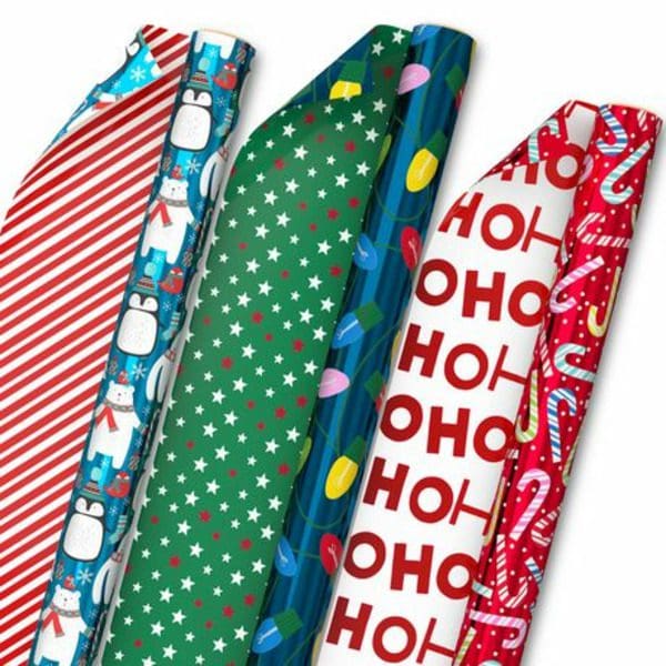 A set of Hallmark Reversible Christmas Wrapping Paper with different designs.
