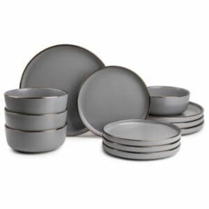 A Thyme&Table 12-Piece Dinnerware Set of grey plates and bowls on a white background.