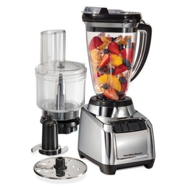 A Hamilton Beach MultiBlend Blender & Food Processor with fruits and vegetables in it.