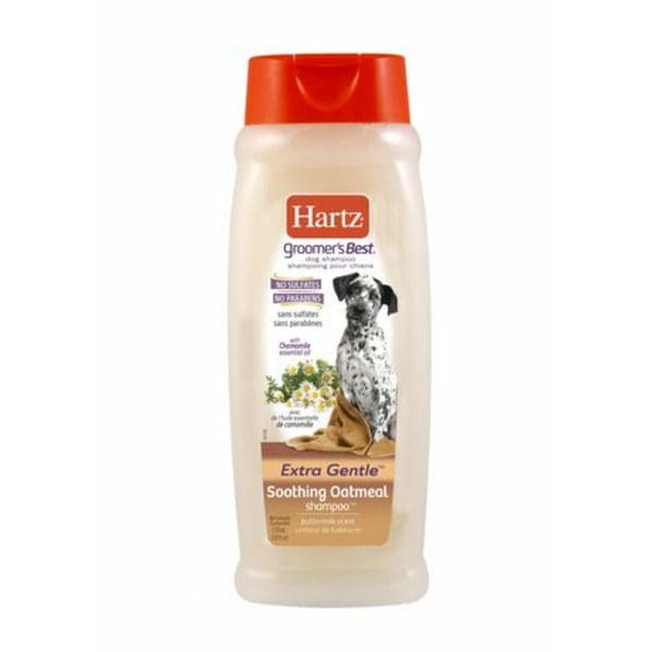 A bottle of Hartz Groomer's Best Oatmeal Shampoo with a dog on it.