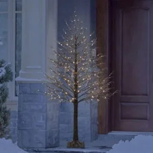 An Iced Tree with LED Lights in front of a house.