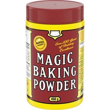 A jar of Magic Baking Powder on a white background.
