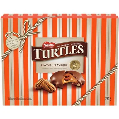 A box of Turtles Classic Holiday Chocolate Gift Box with chocolate and pecans.