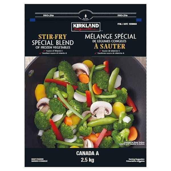 A bag of Kirkland Signature Frozen Vegetable Special Blend Stir Fry in a wok.